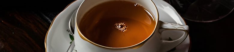 A fancy tea scene with a stacked dessert platter, assorted pastries, and a frothy cocktail on the side, perfect for a luxurious afternoon treat.